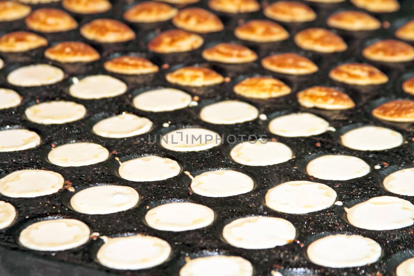 freshly baked traditional Dutch mini pancakes called "poffertjes