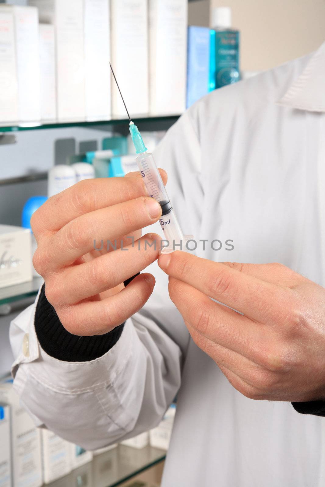 pharmacist holding injection indoor