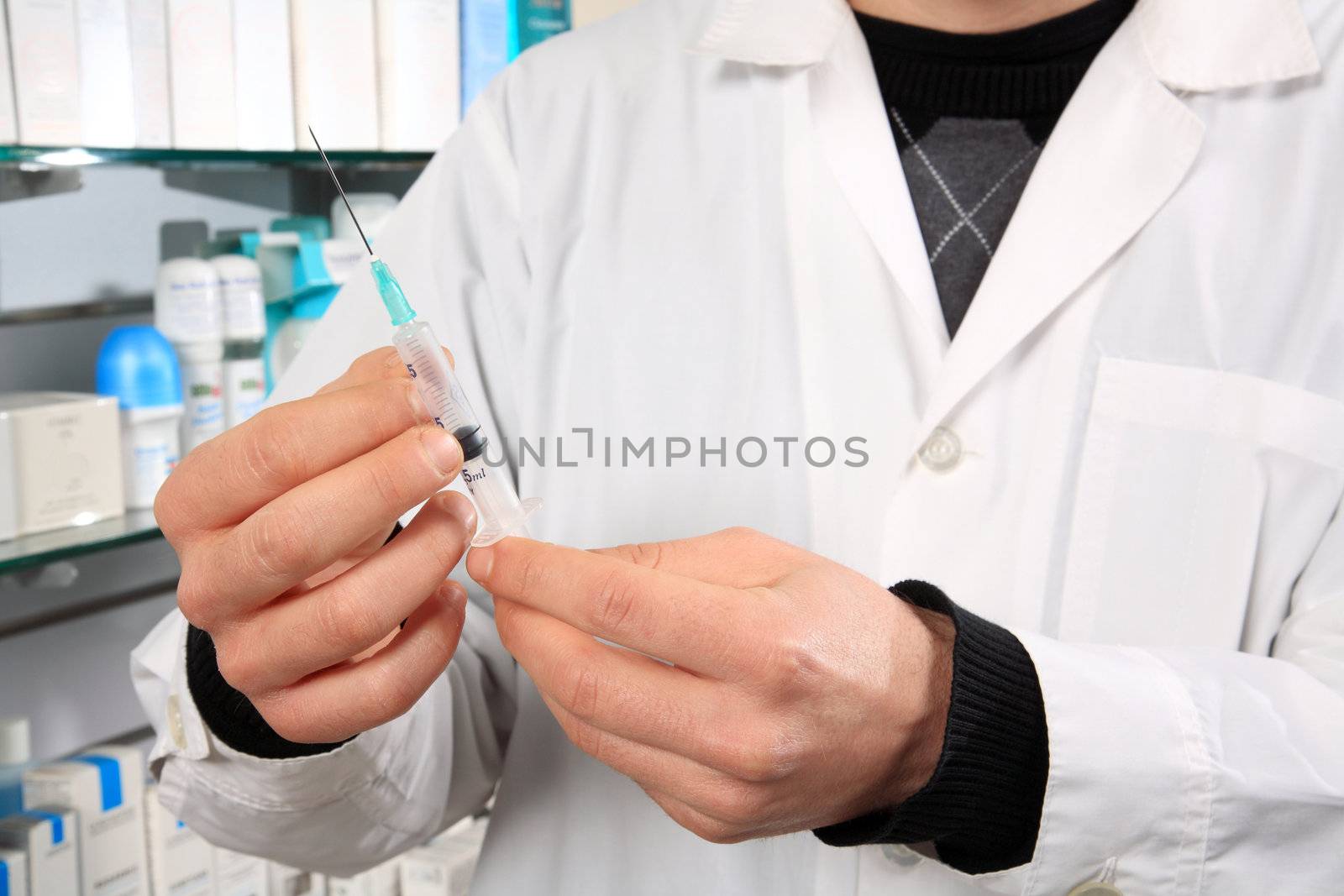 pharmacist holding injection indoor