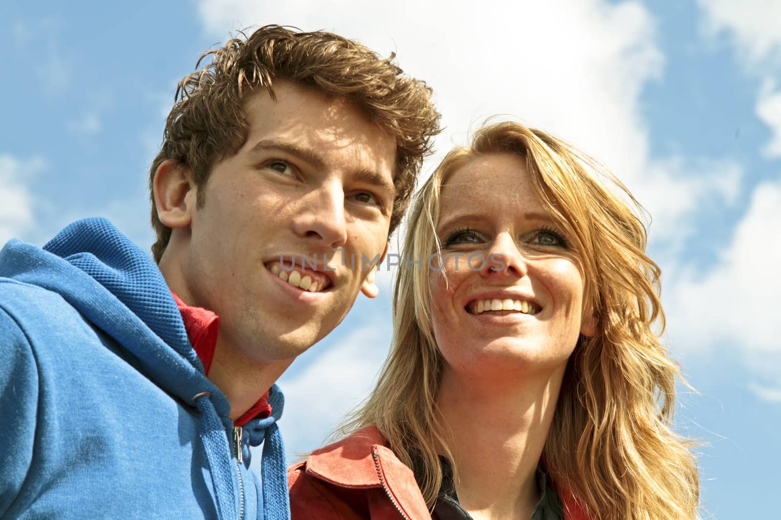 Young happy couple making a picture in the tulip fields from the Netherlands