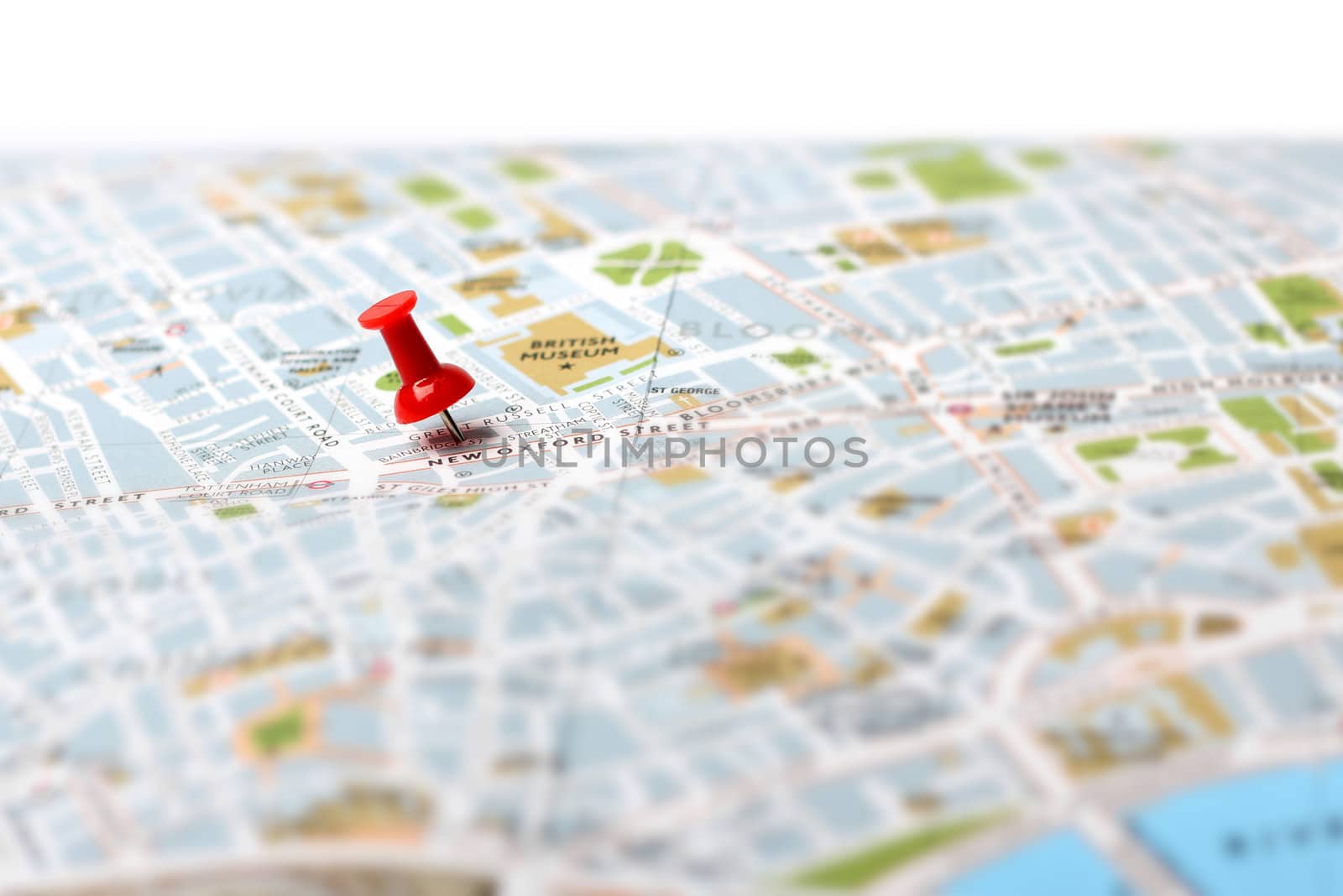 Red push pin pointing planned travel destination on map