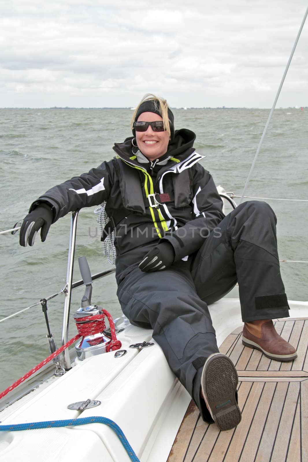 Relaxing during sailing on the IJsselmeer in the Netherlands