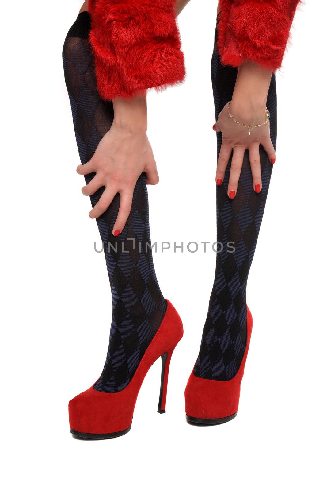 legs on red shoes isolated on a white background