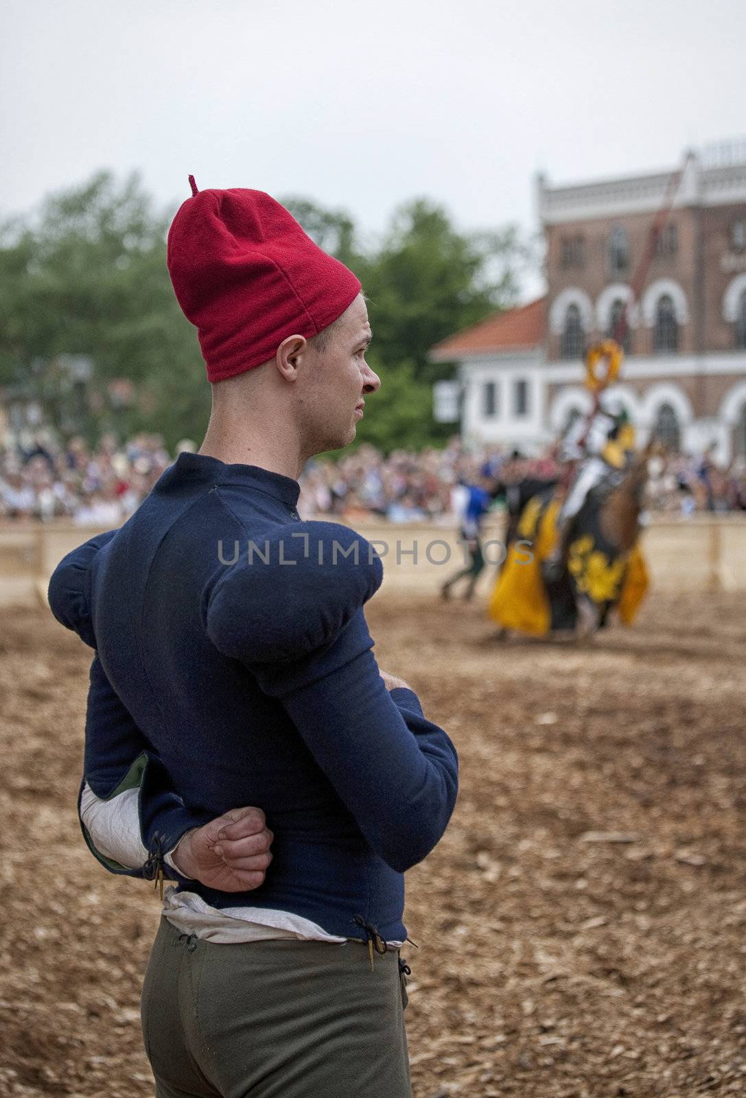 NYBORG DENMARK, JUNE 30, 2012: A squire looking at his master fighting in the  2012 Knights tournament of Nyborg, Denmark in front of the old town hall of Nyborg.
