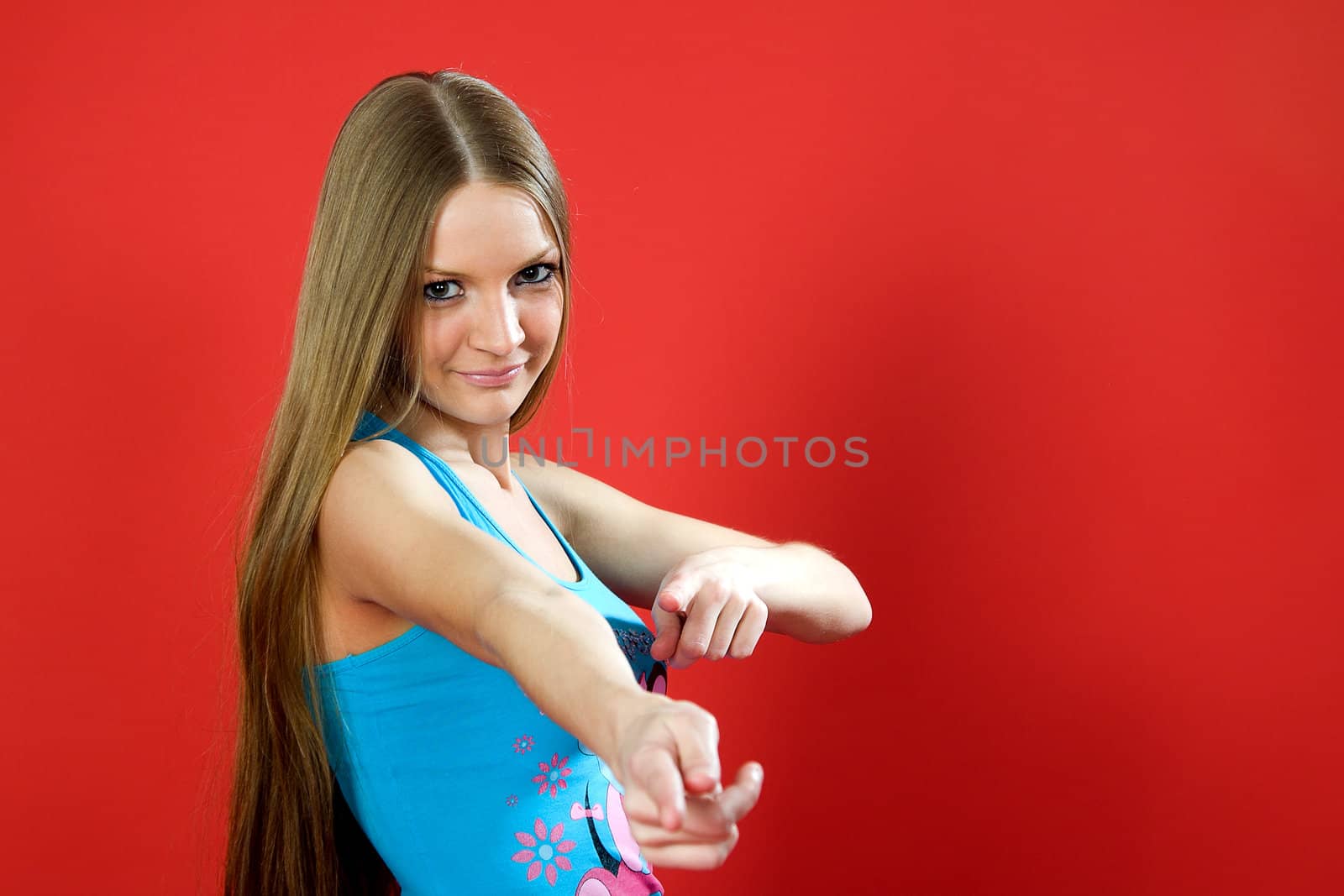 beautiful girl smile showing thumbs on red background