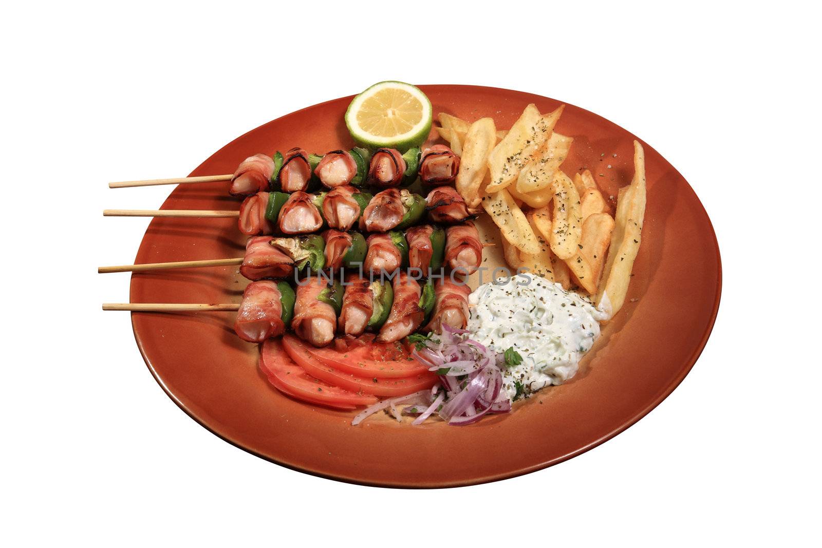 chicken skewers with beacon and green peppers served on a plate