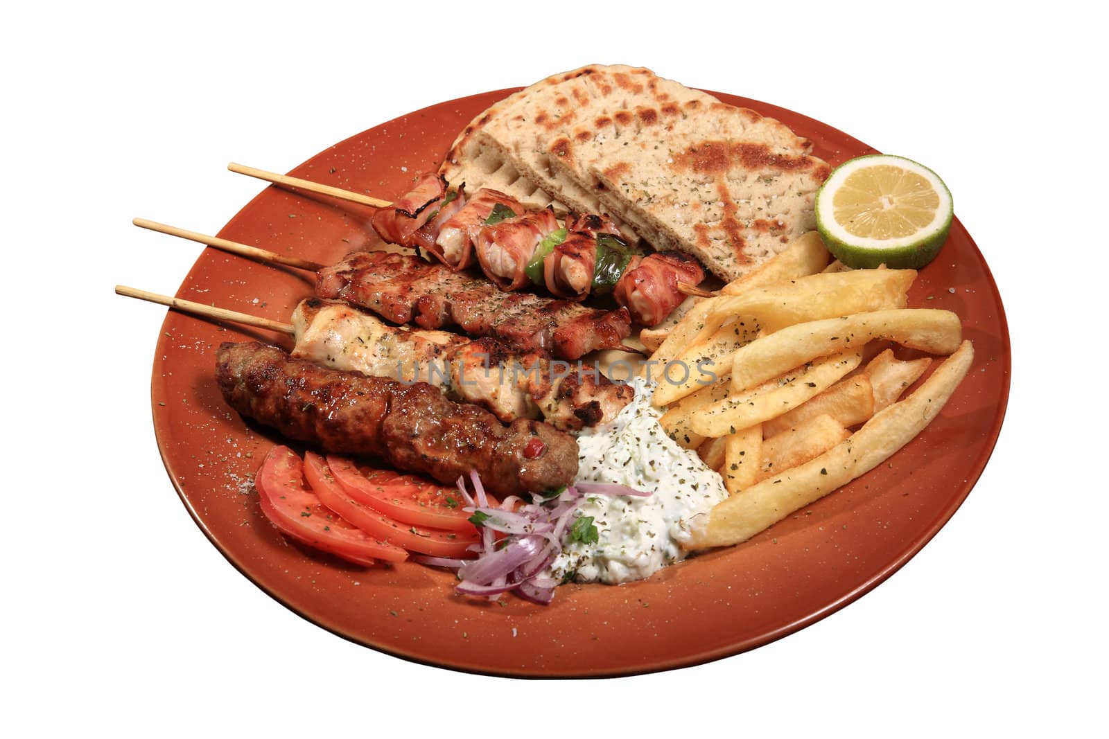 mix grill of skewers served on a plate with pita fries and tzatziki