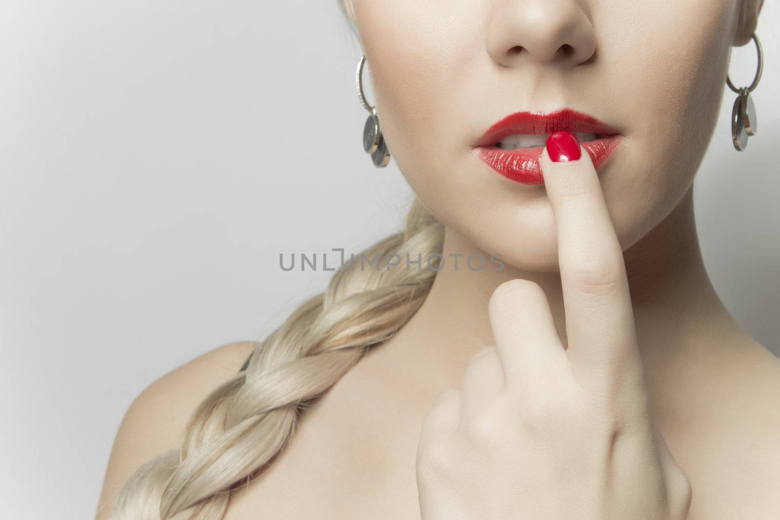 Close-up photo of a beautiful red female lips, girl portrait