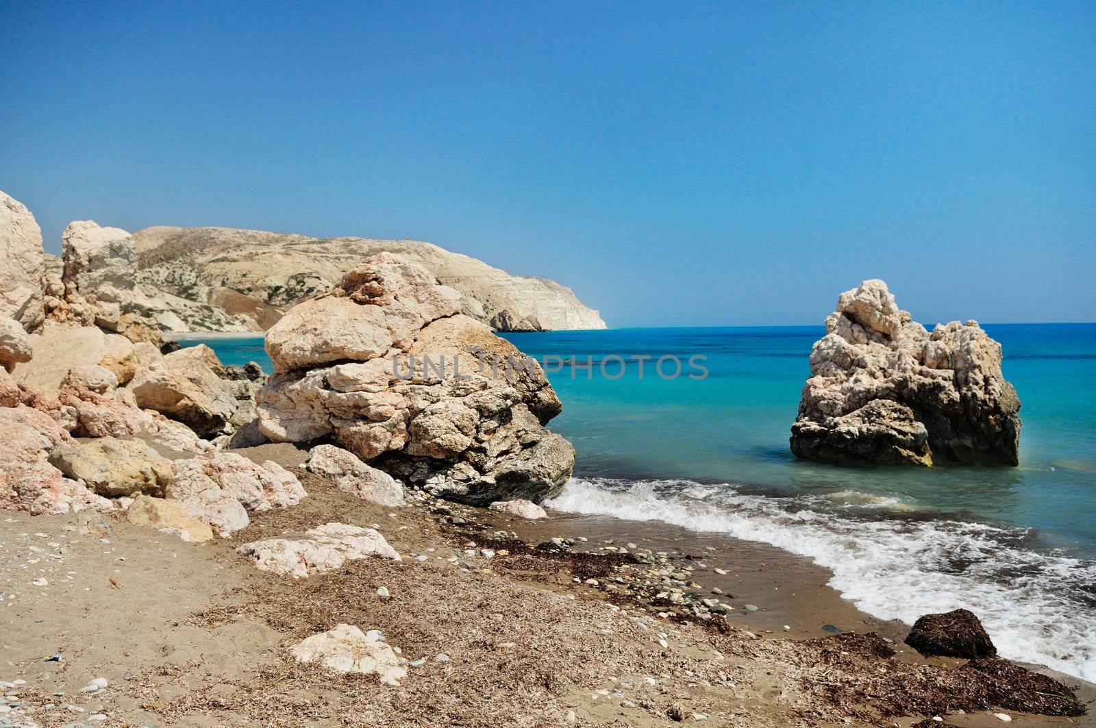 Rocky shore of the Mediterranean sea with clear water. Birthplace of Aphrodite. Cyprus.