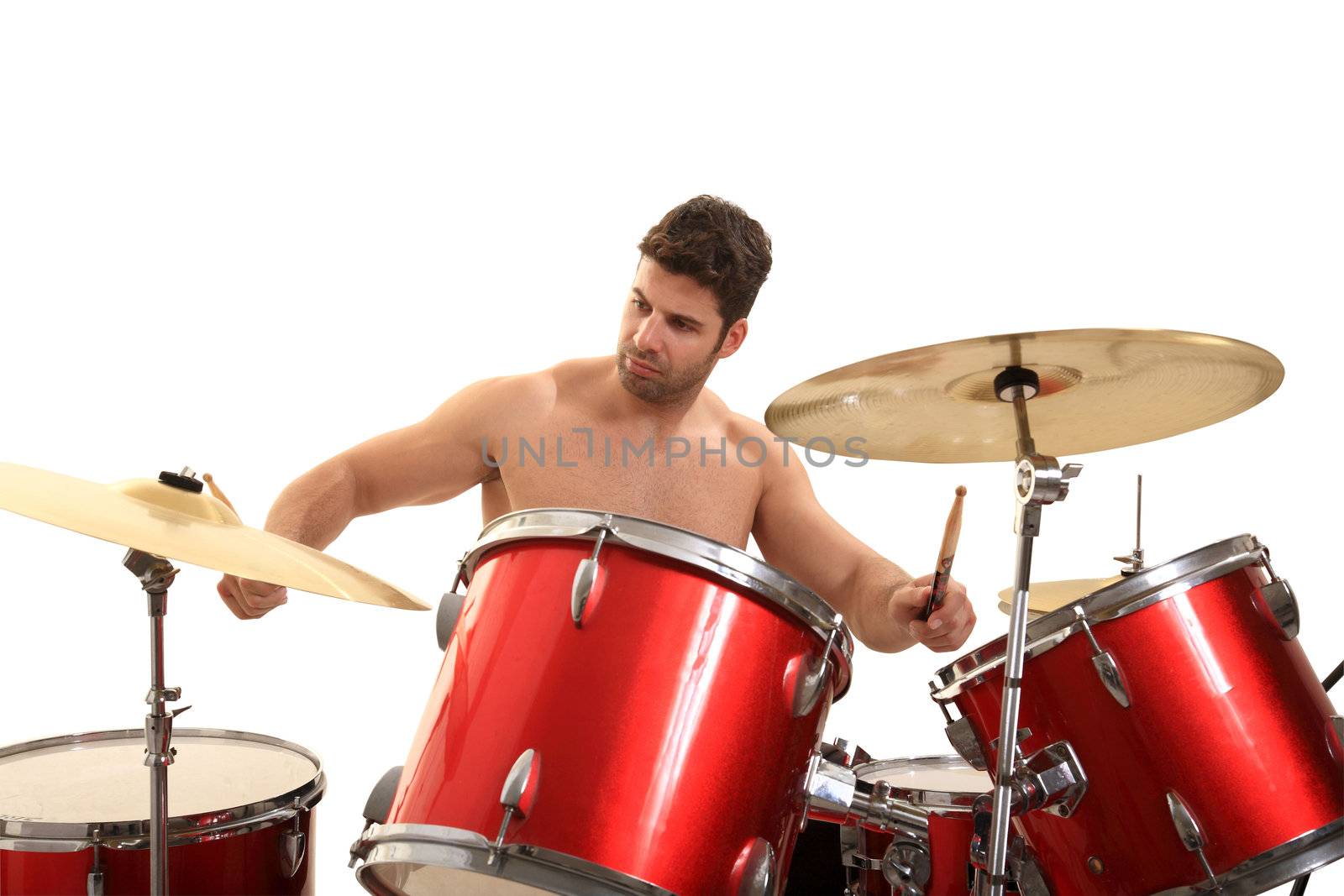 young male drummer isolated on a white background