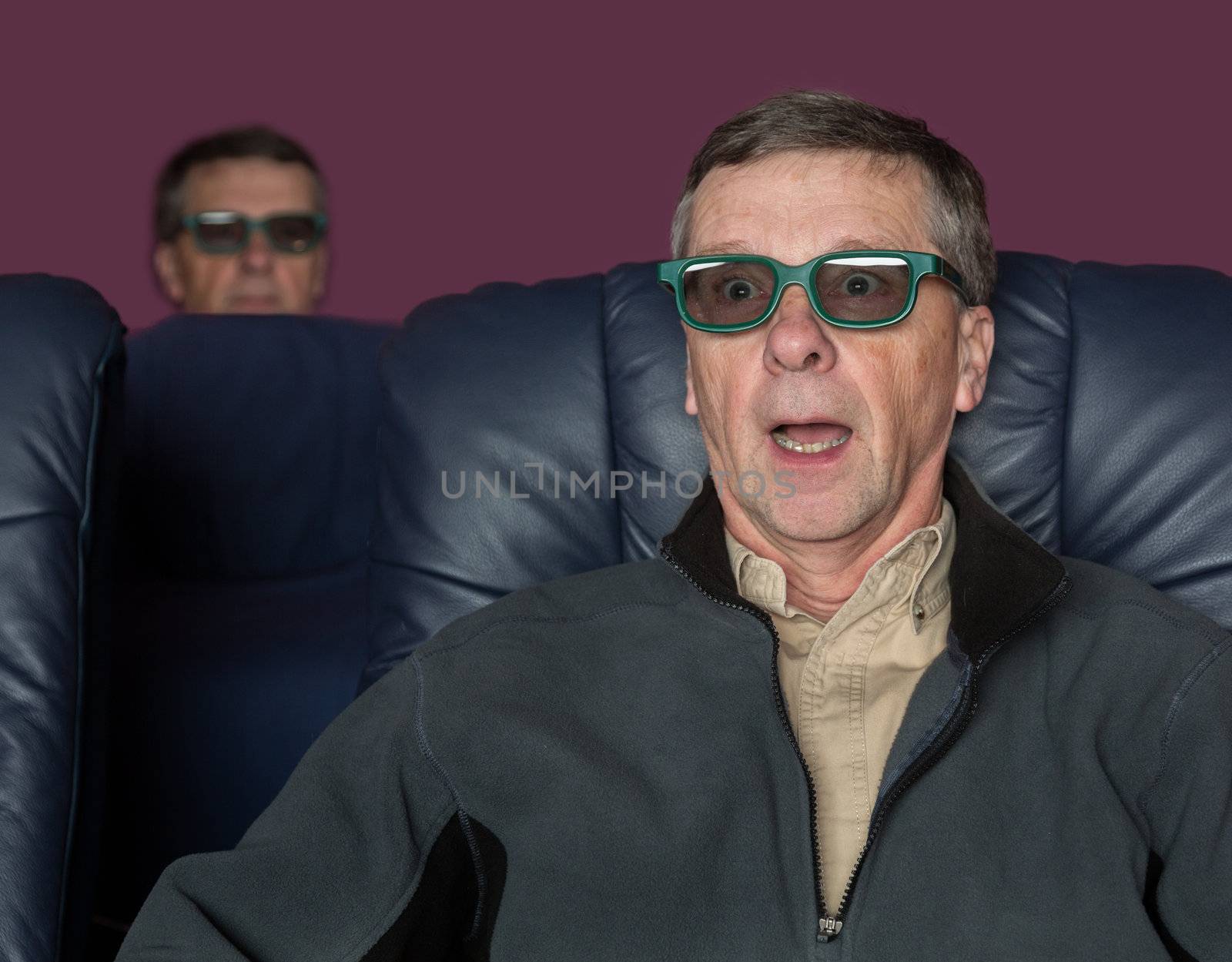 Senior man watching movie with 3d glasses by steheap