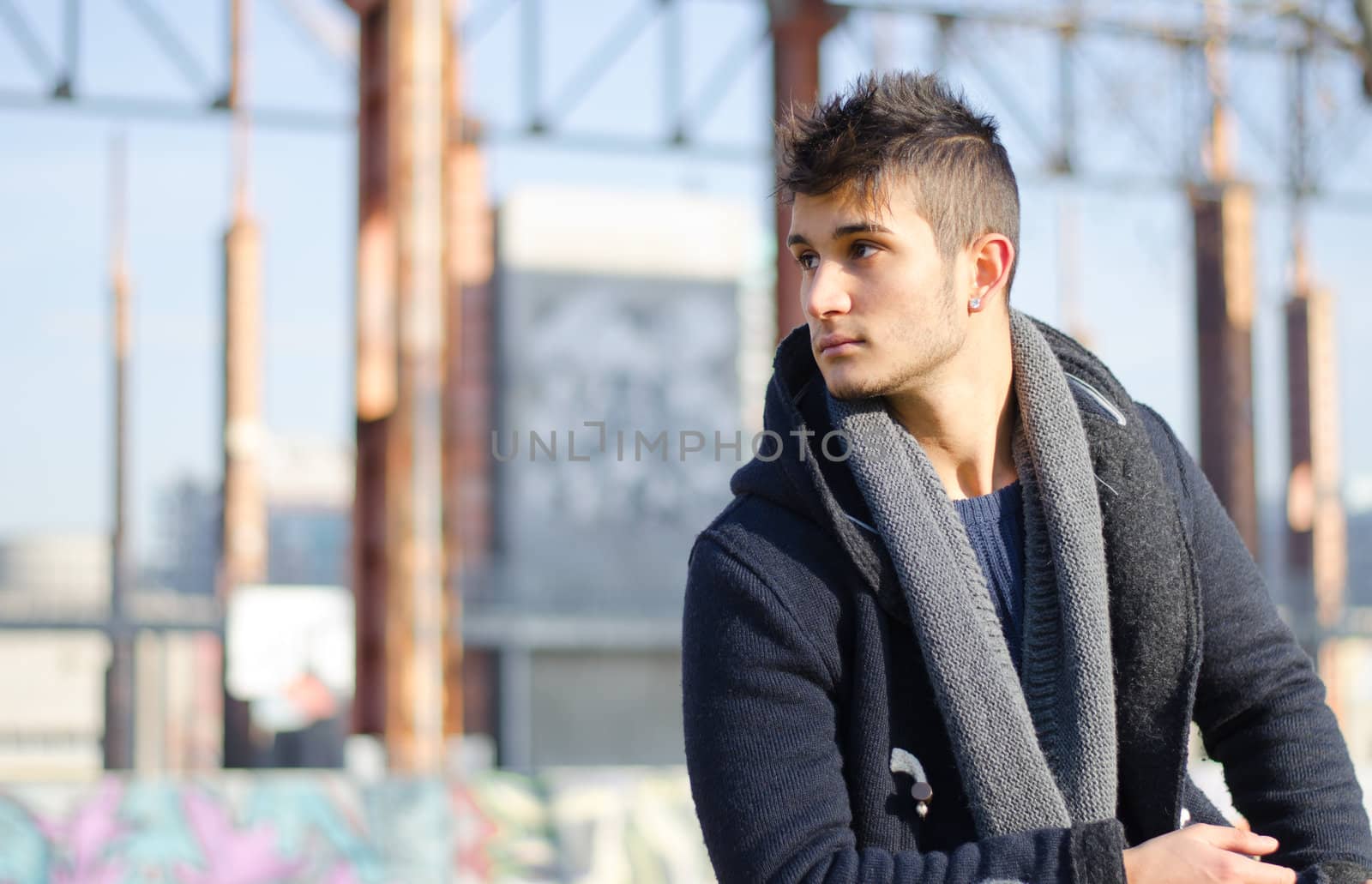 Attractive guy in urban environment, large copy-space by artofphoto