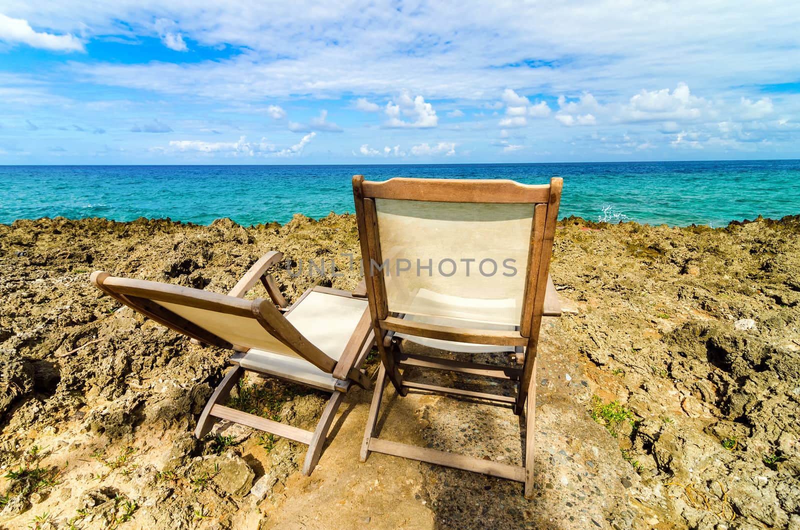 Beach charis and turquoise blue water in San Andres, Colombia