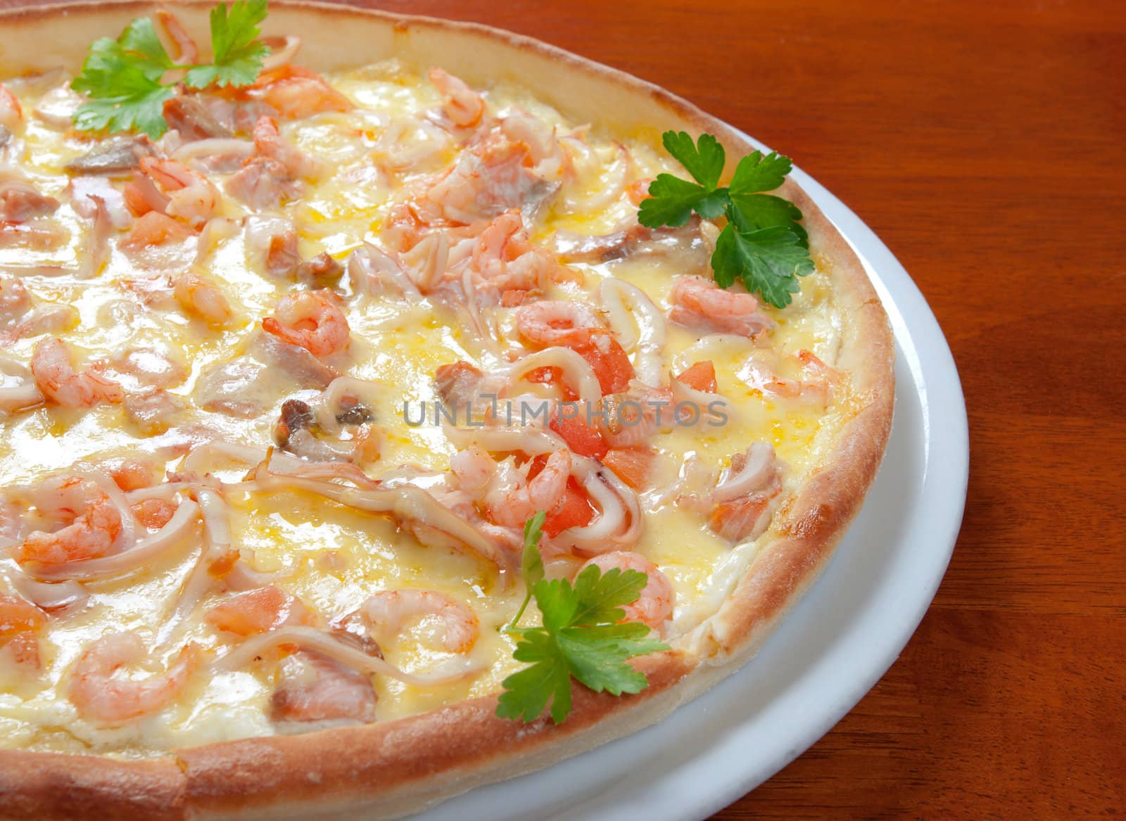 Tasty Italian pizza  on plate.Italian kitchen.seafoods,prawns