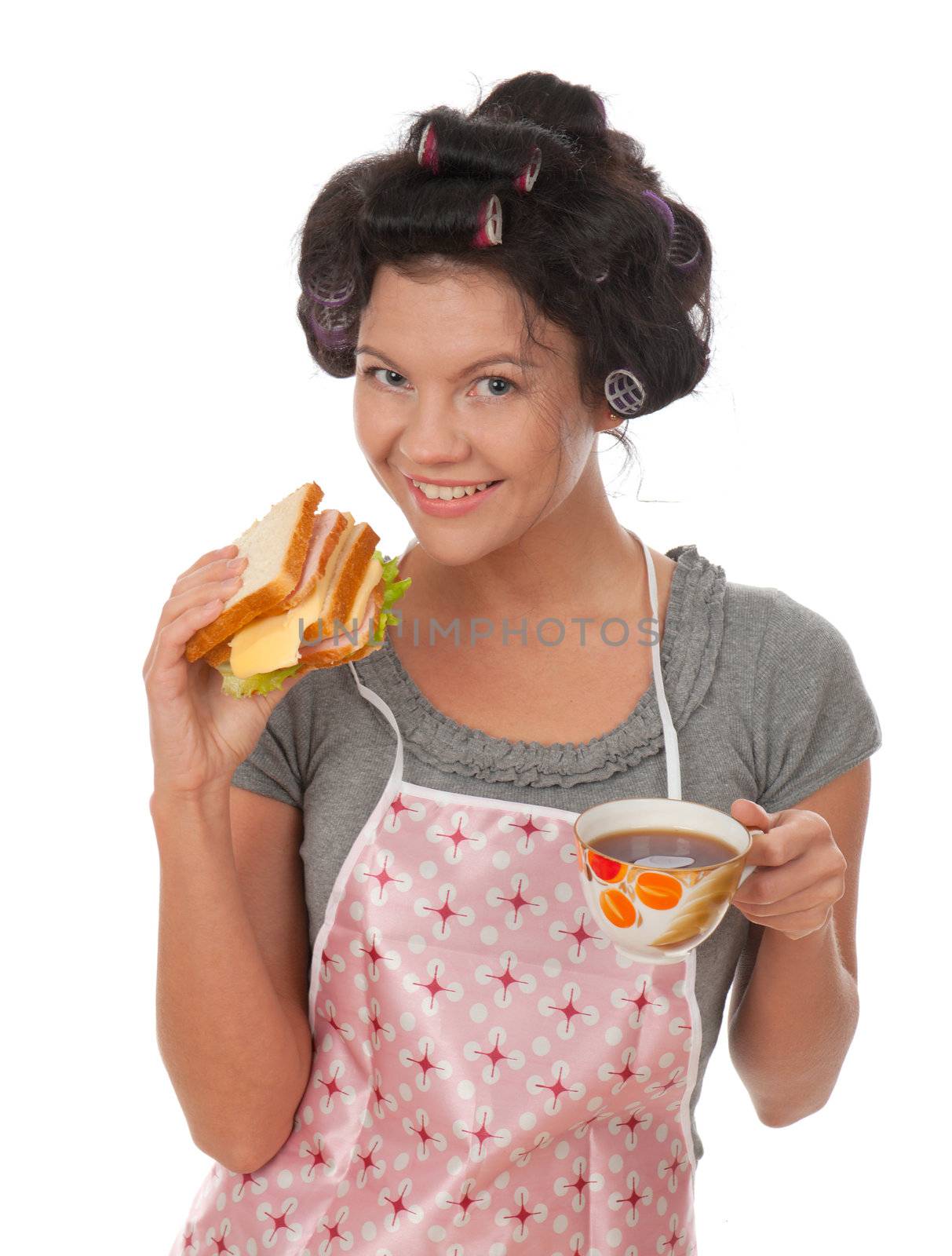 Beautiful cooking woman in apron with sandwich.Studio, white background. 