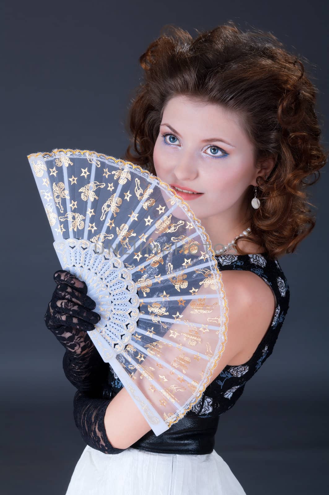 Elegant women   with fan by Fanfo