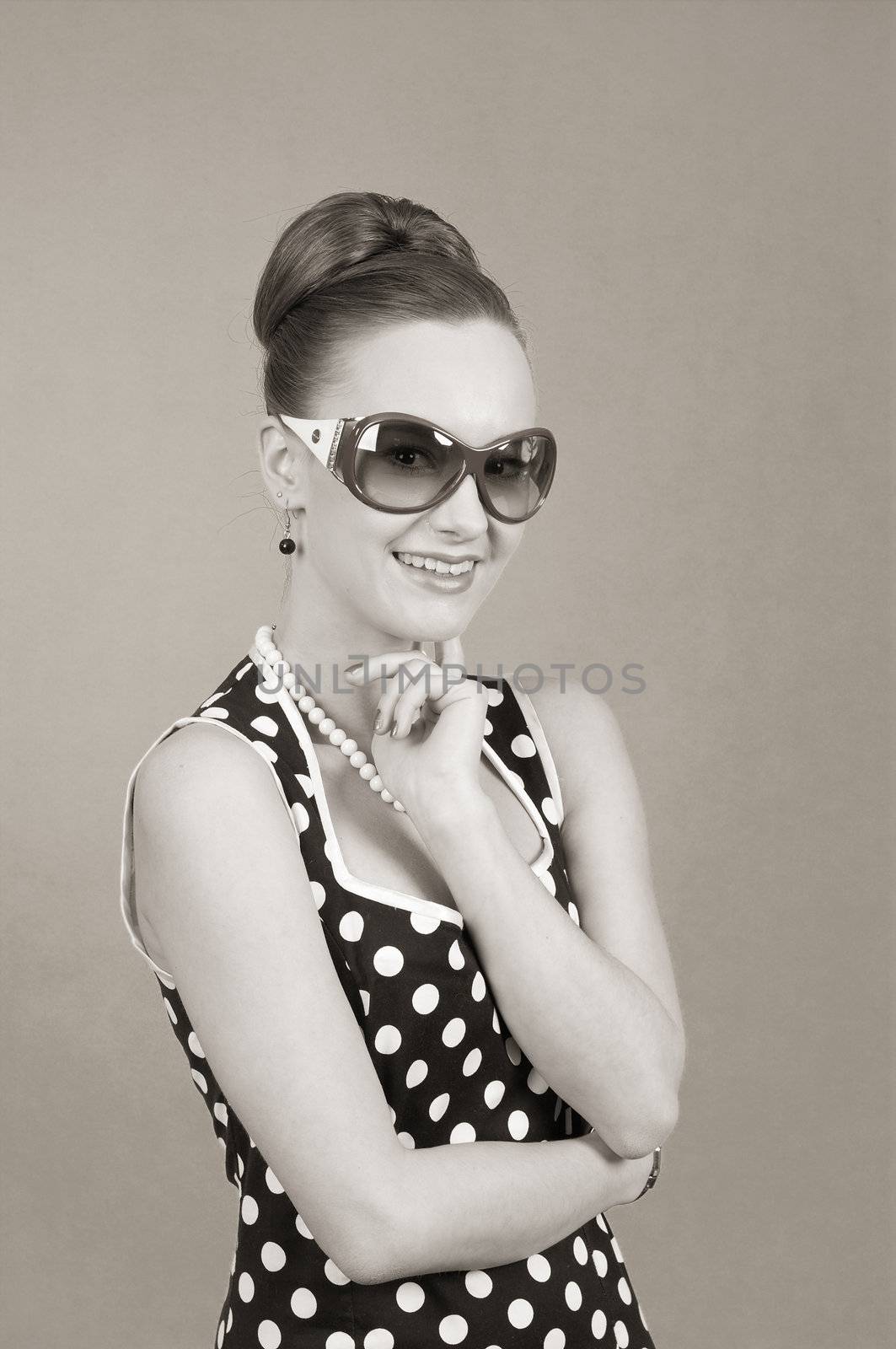 Girl in american 60s style in  sunglasses