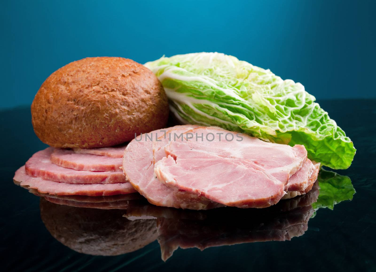 Beautiful sliced food arrangement of meat, bread and vegetables 