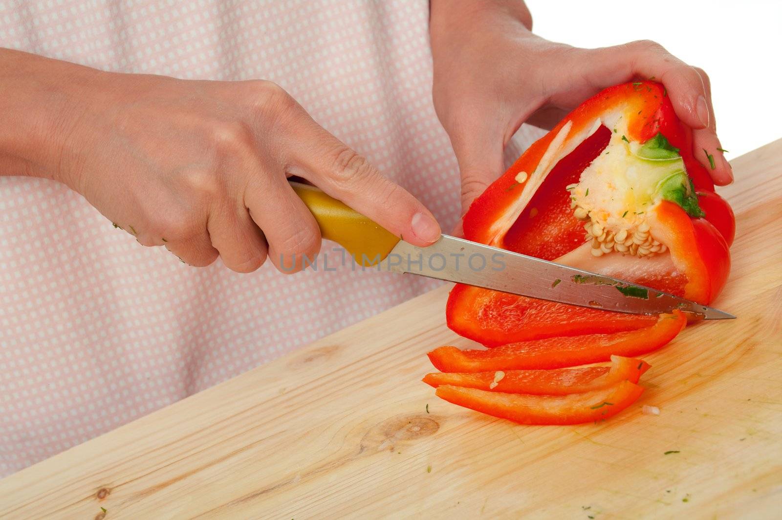 housewife preparing  paprika .Studio, white background. 