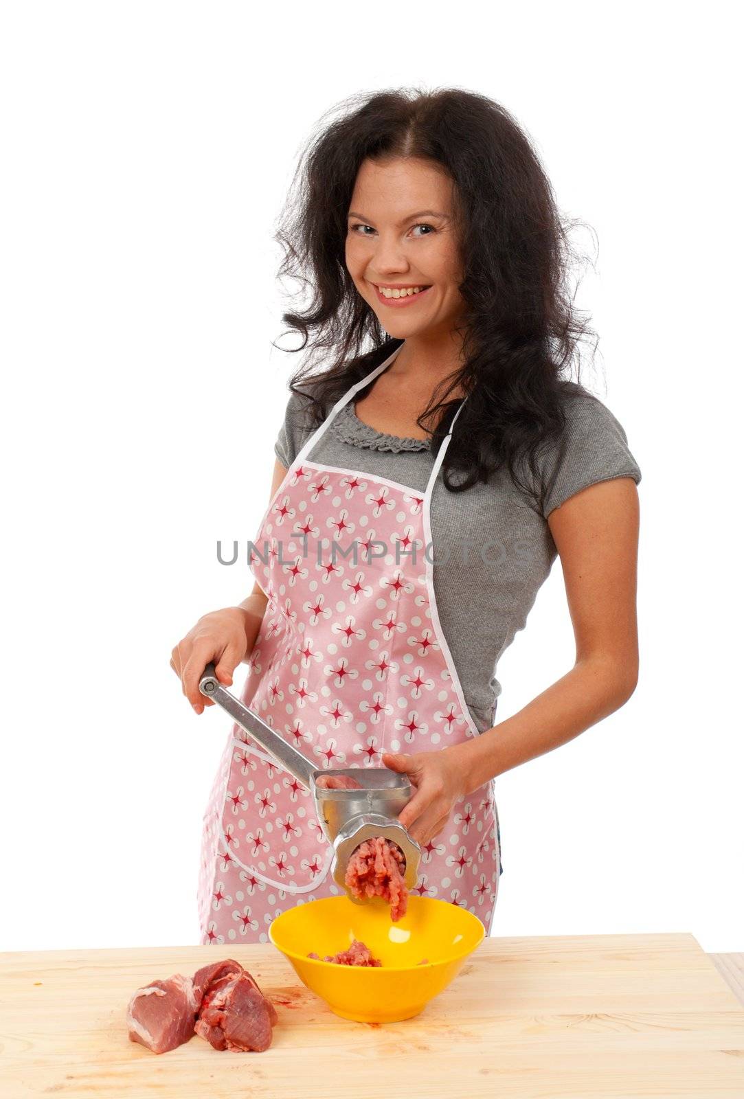 Meat Grinders  .beautiful housewife cutting meat. .Studio, white background. 