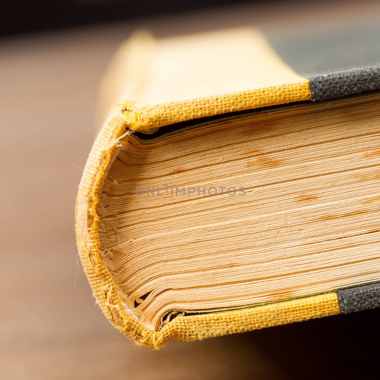Close-up of an old book on a wooden table