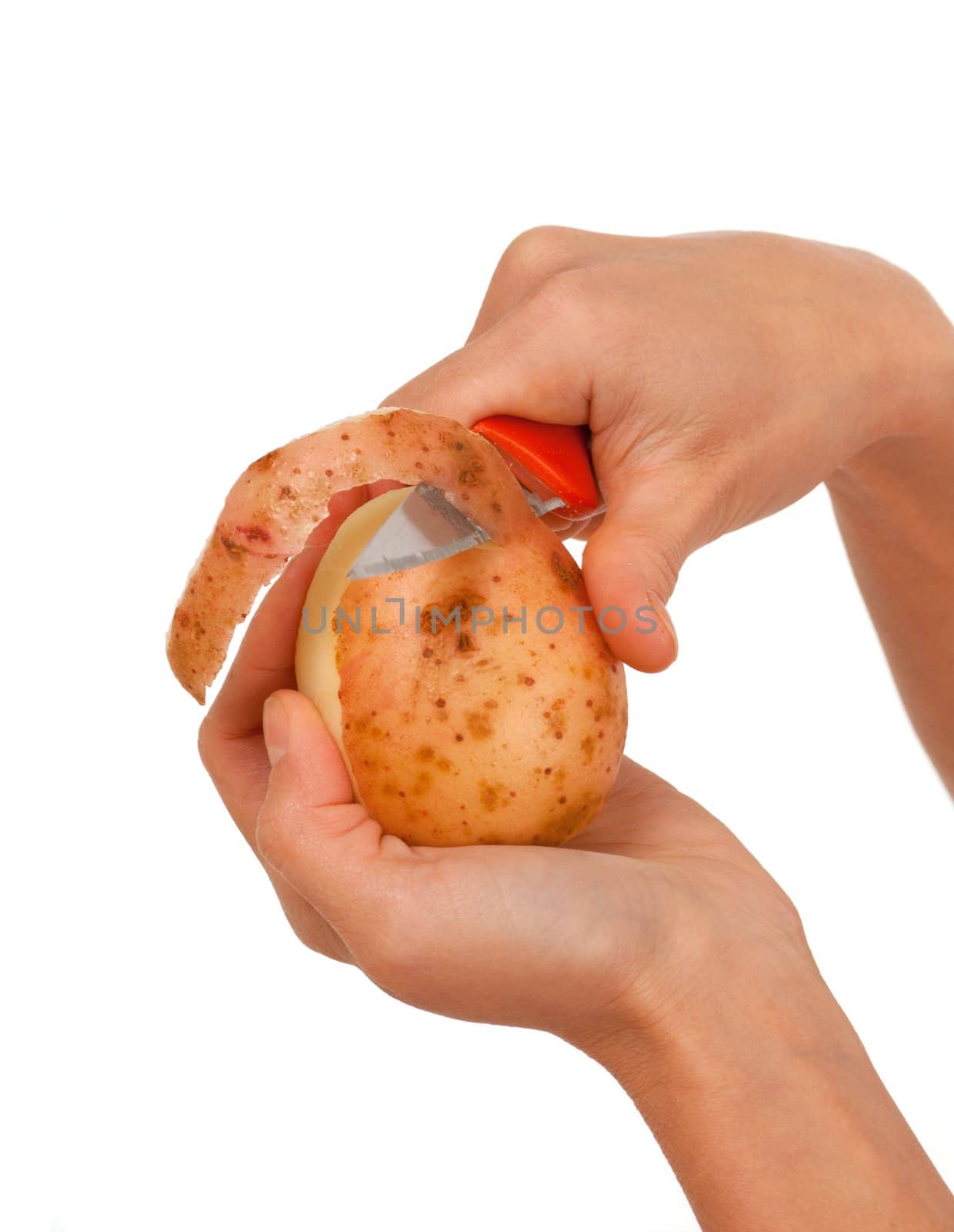 Hand holding knife peeling potato vegetable food .Studio, white background. 