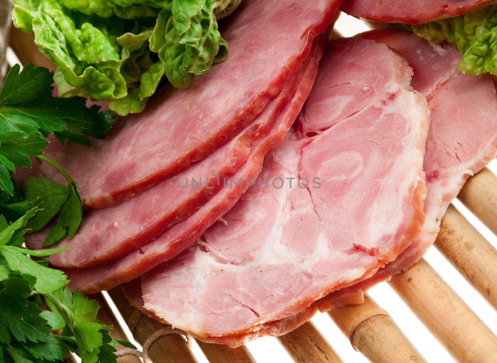 Beautiful sliced food arrangement of meat, bread and vegetables . bamboo napkin