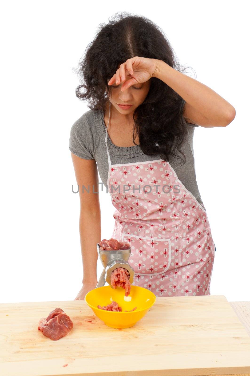Meat Grinders  .beautiful housewife cutting meat. .Studio, white background. 