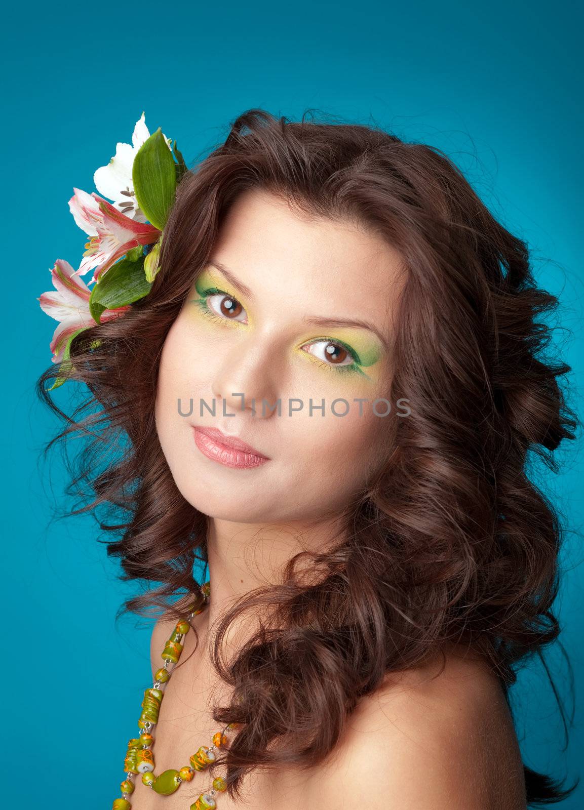 Portrait of beautiful girl with flowers in her hair 