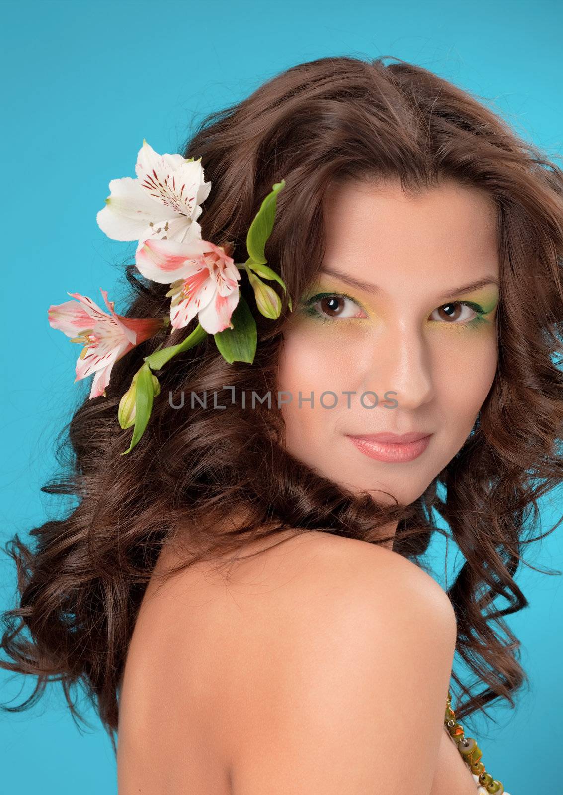 Portrait of beautiful girl with flowers in her hair 