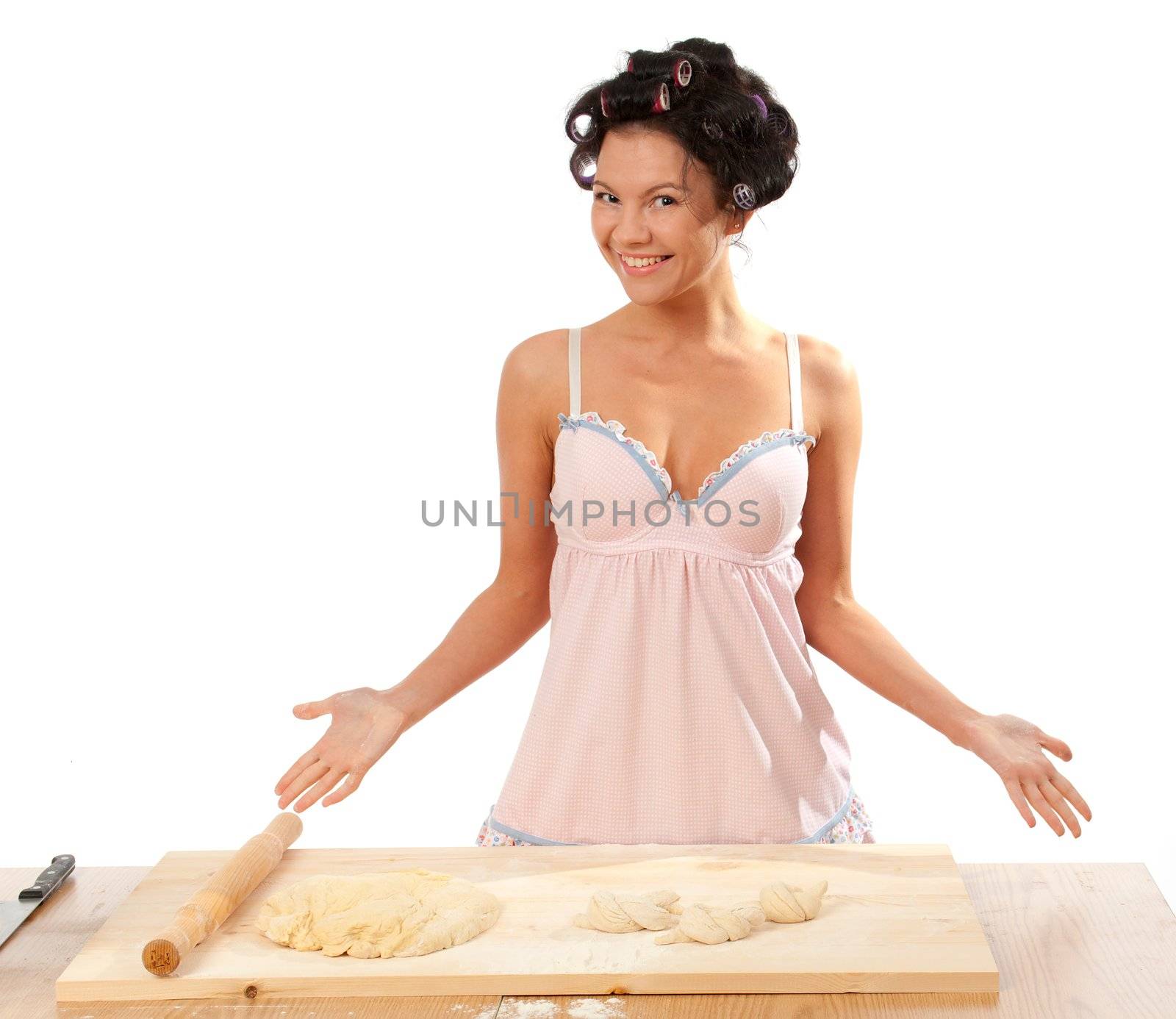  housewife making buns .Studio, white background. 