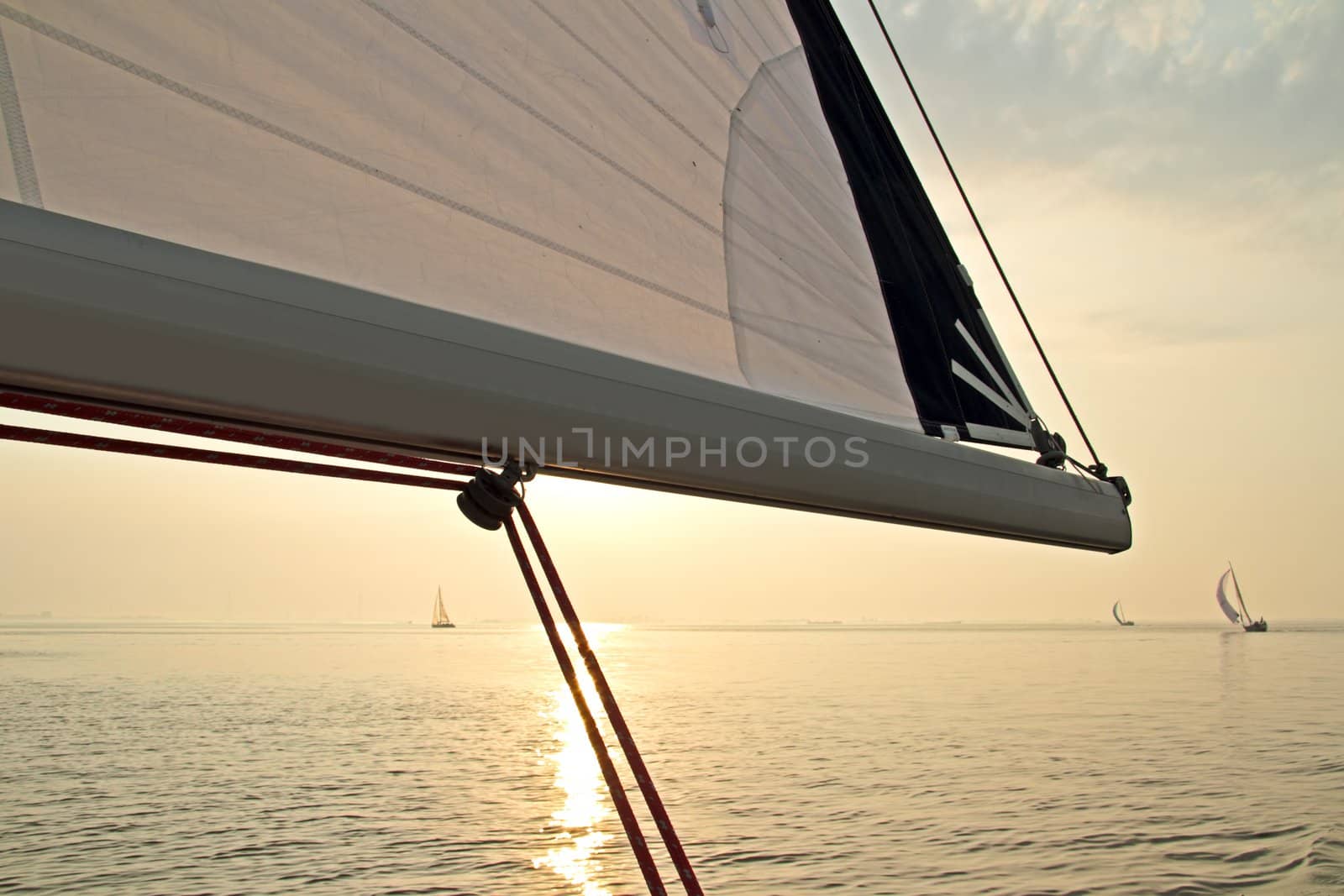 Sailing on the IJsselmeer at sunset in the Netherlands by devy