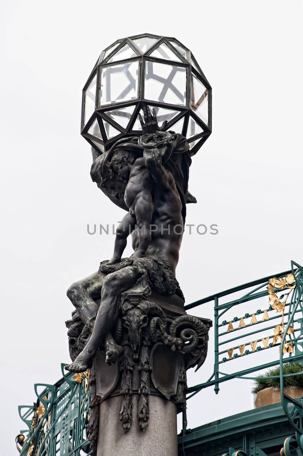 Art Nouveau sculpture at the top of a building in Prague