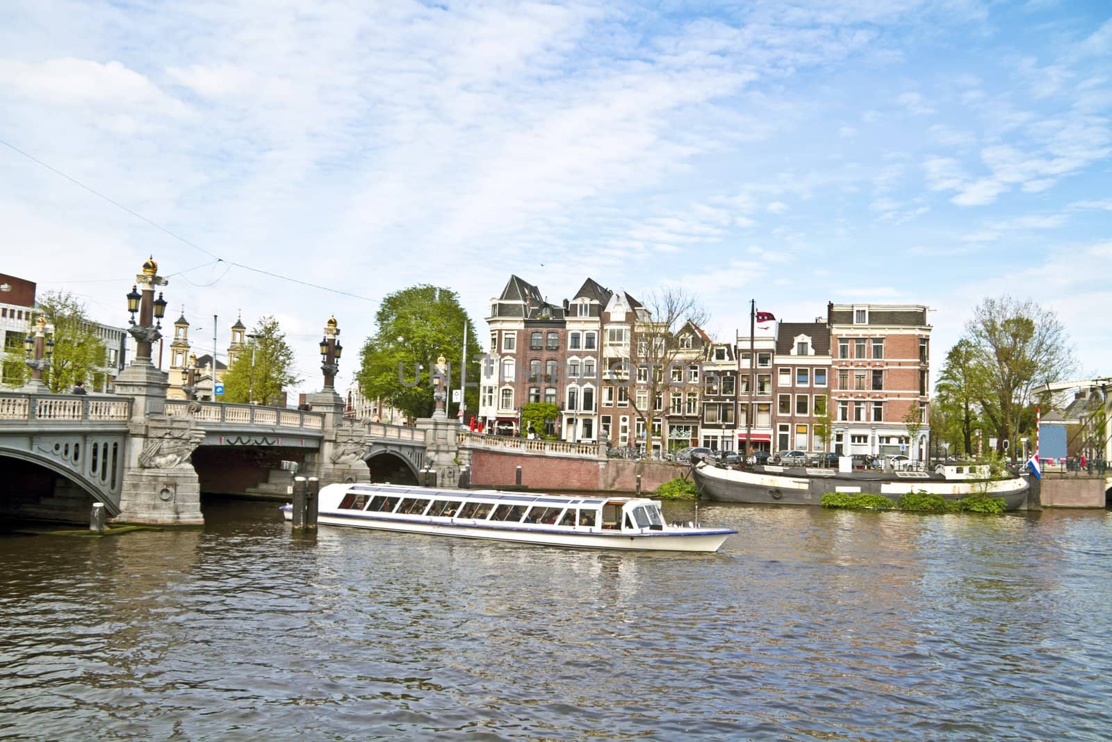 Sightseeing in Amsterdam the Netherlands on the river Amsteld by devy