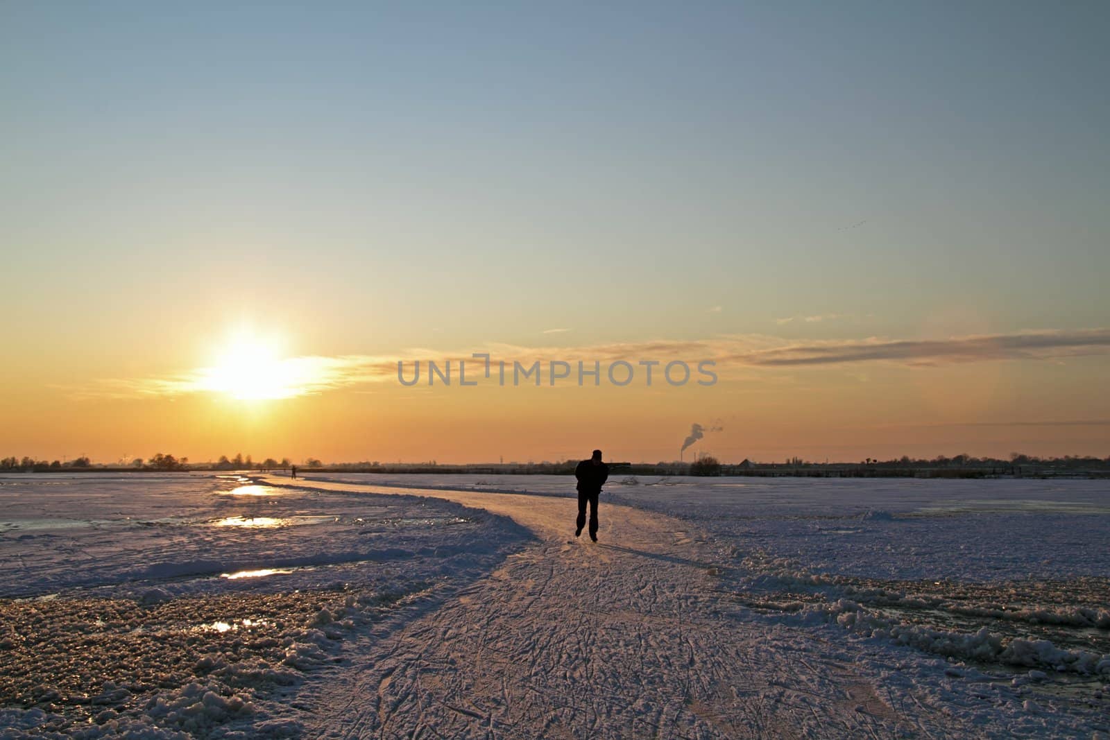 Ice skating in the countryside from the Netherlands at sunset by devy