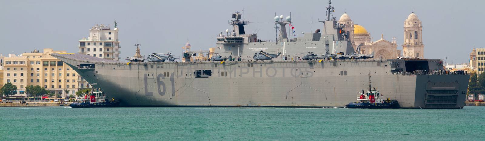 CADIZ, SPAIN-JUN 01: Aircraft carrier L-61 Juan Carlos I docking to take part in an exhibition on the day of the spanish army forces on Jun 01, 2012, in Cadiz, Spain