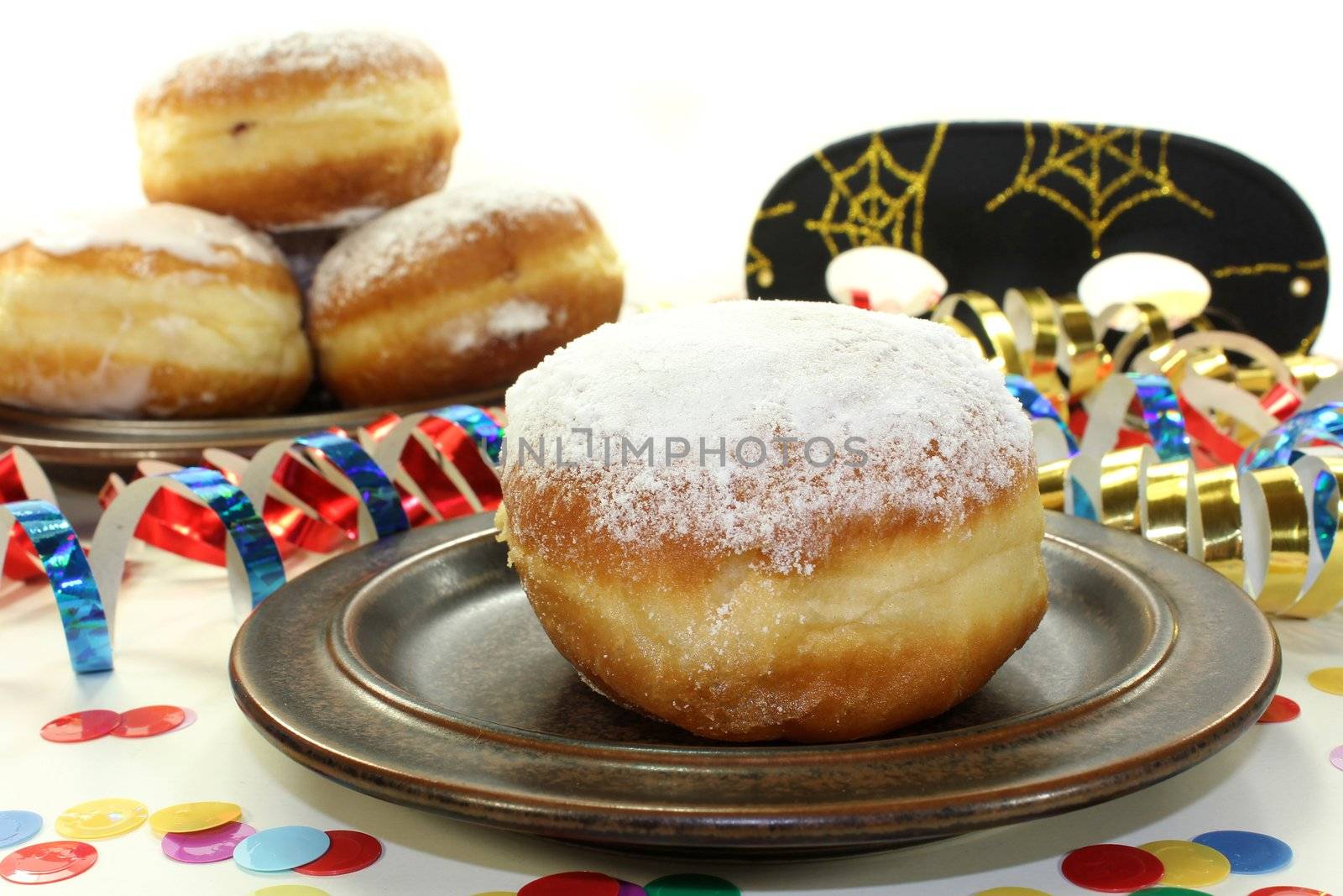 a plate of donuts and carnival decoration