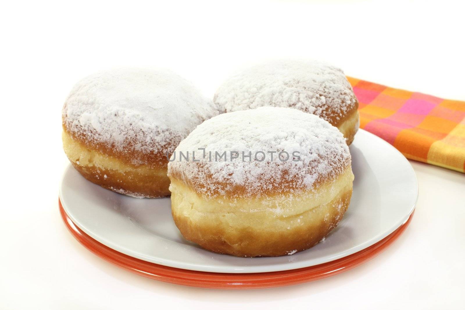 a plate of donuts on a white background