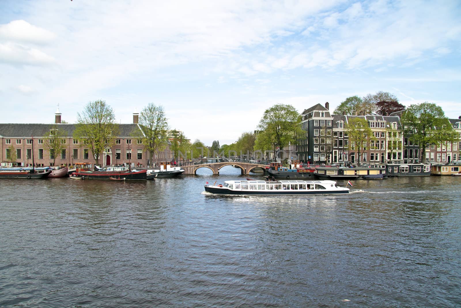 Cruising on the river Amstel in Amsterdam the Netherlands