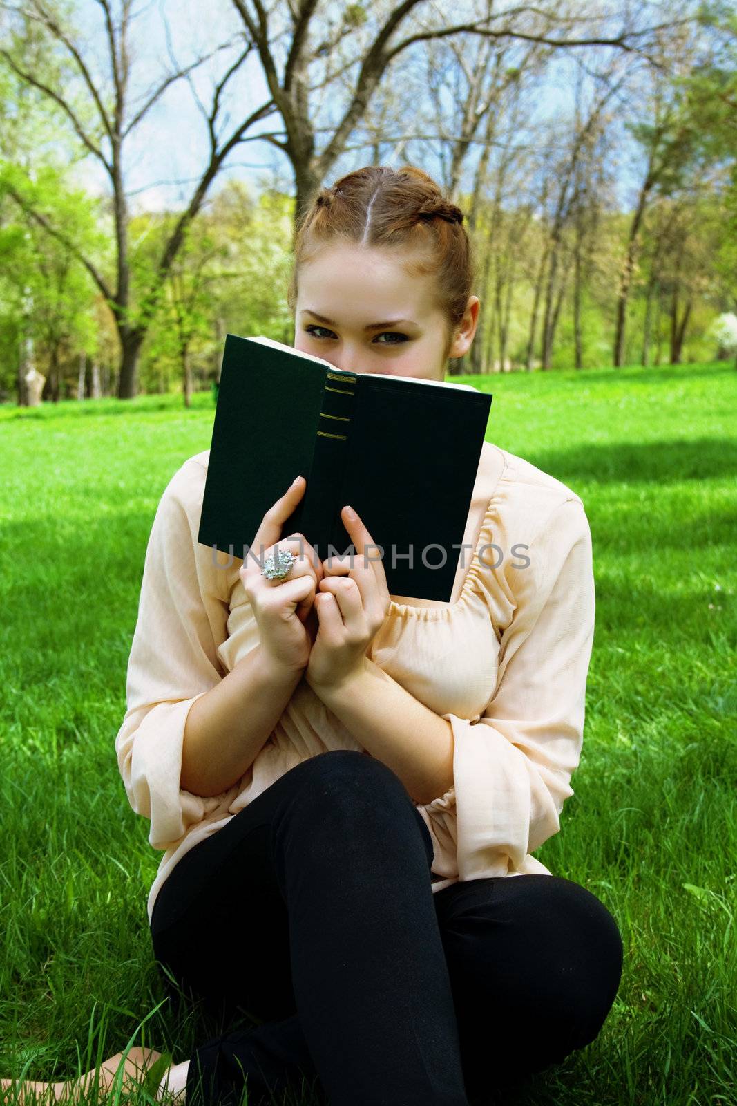 girl in the park with a book by Irina1977