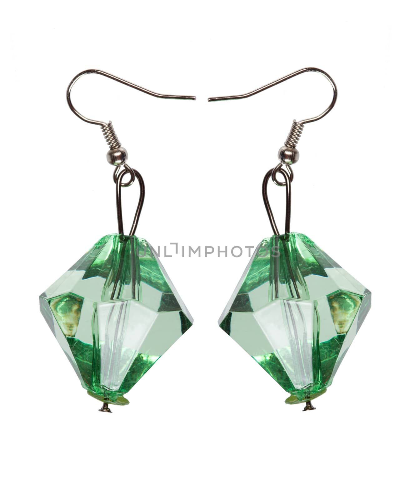 Earrings made of green glass faceted. Isolated on white background