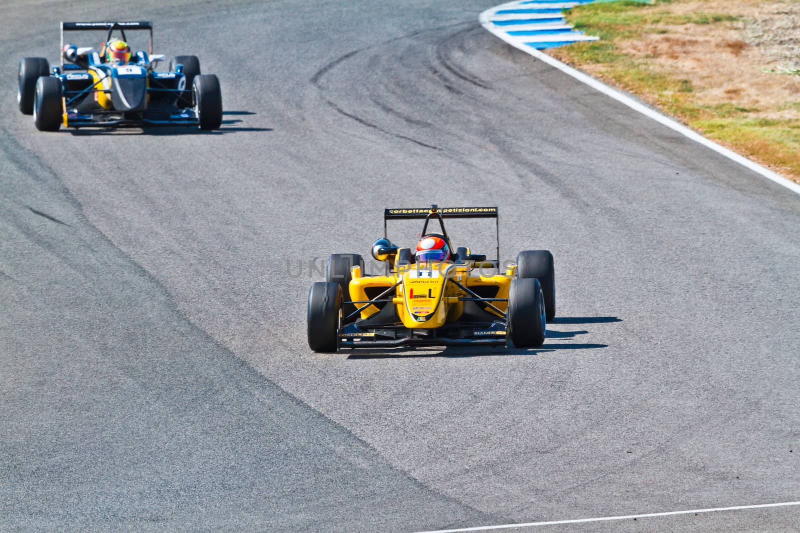 JEREZ DE LA FRONTERA, SPAIN - OCT 16: Matteo Tortan(11) followed by Yann Cunha (9) races on European F3 championship on October 16 , 2011, in Jerez de la Frontera , Spain