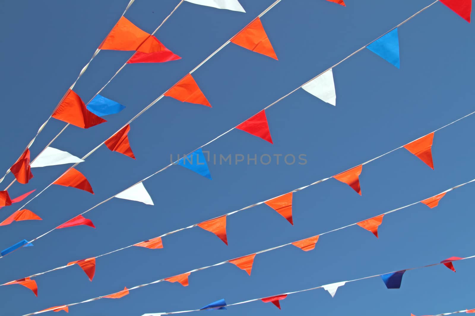 Little colored flags and a blue sky