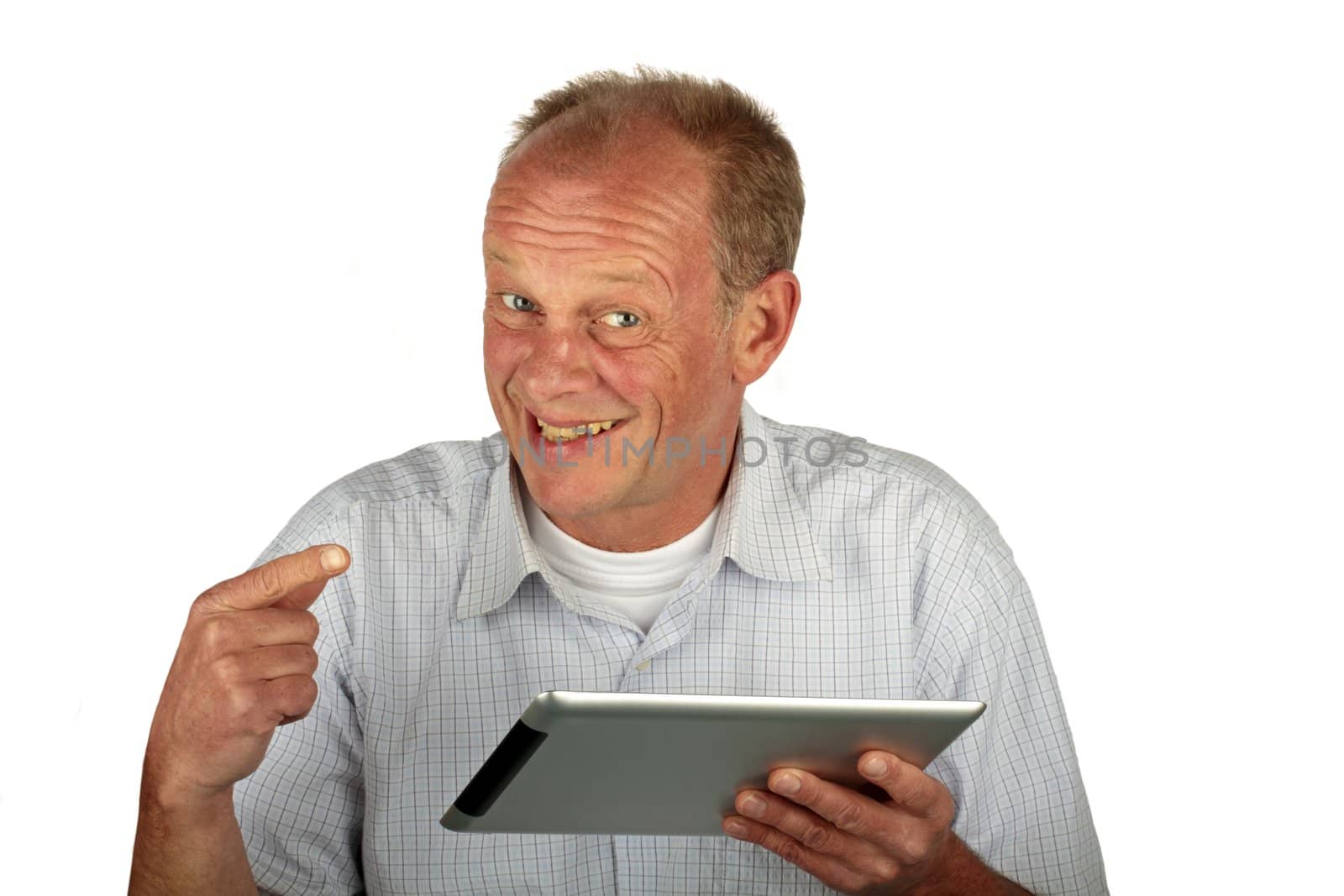 Happy man pointing at his tablet computer on a white background