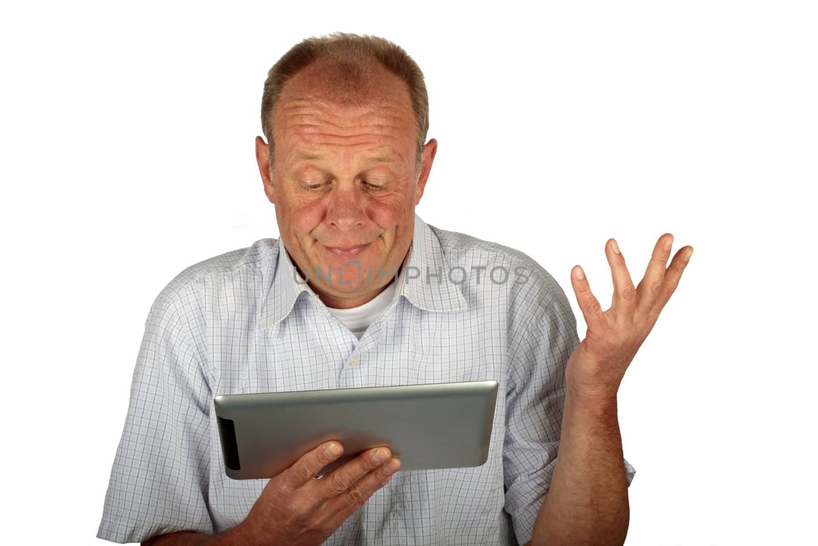 Astonished business man with his tablet computer on a white background