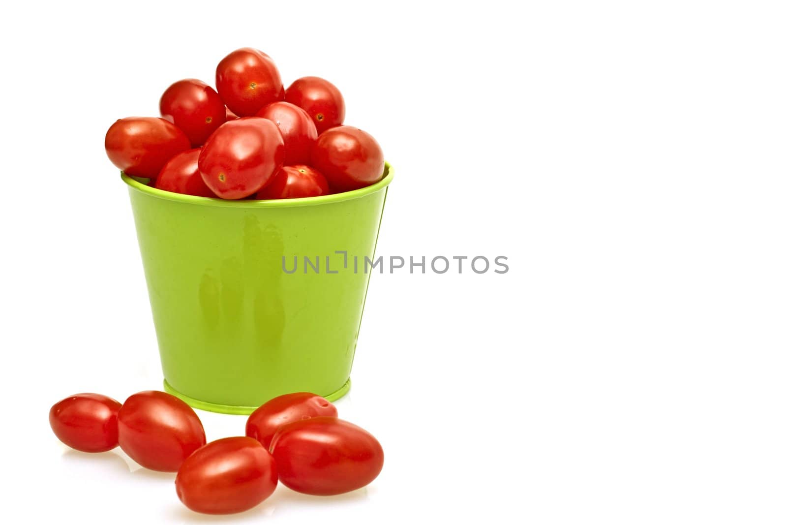 Tomatoes in a green bucket