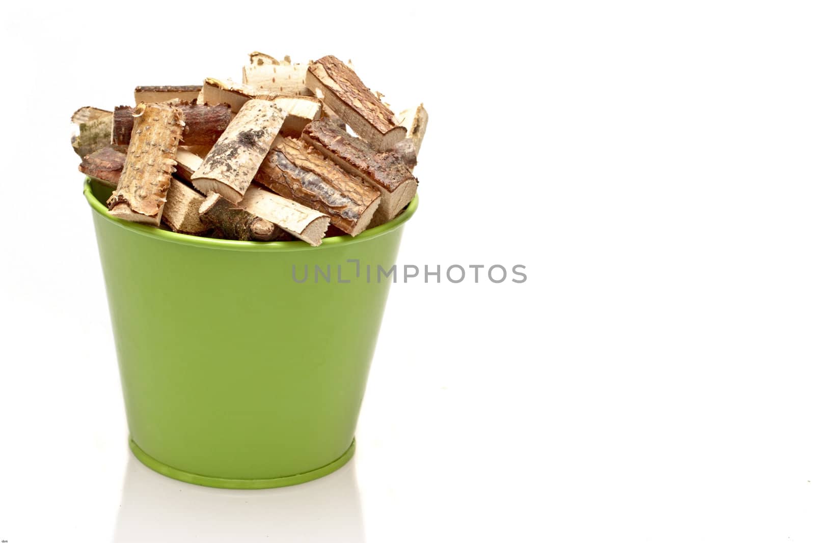 Green bucket full of fire wood blocks