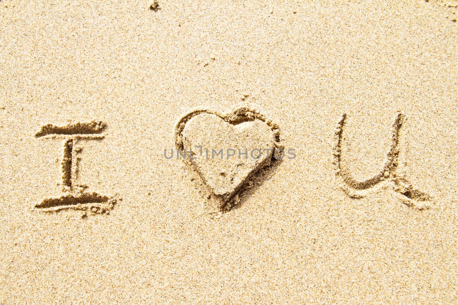 I love you written in sand for natural, love,tourism or conceptual designs