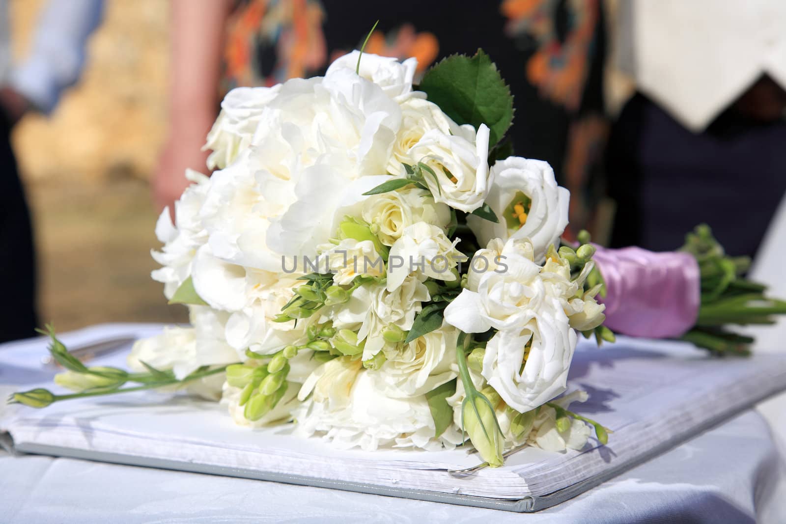 close up of wedding bouquet with white roses