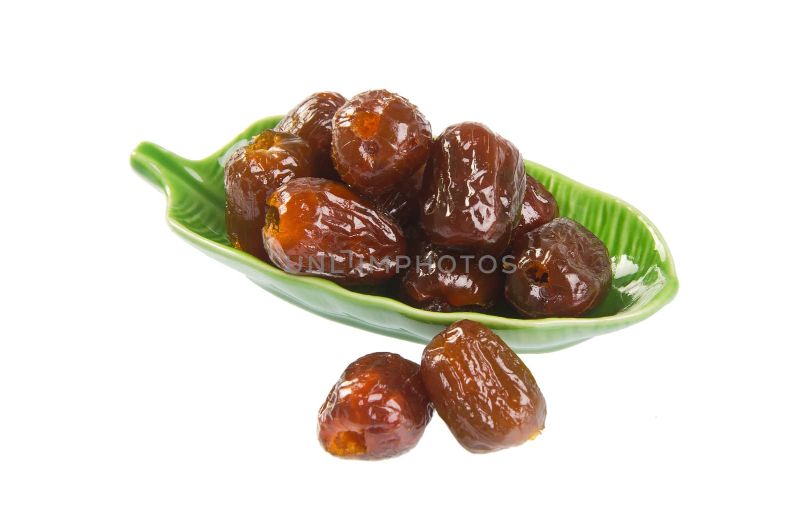 Dried preserved. Sweet syrup monkey apple or Chinese date on the background